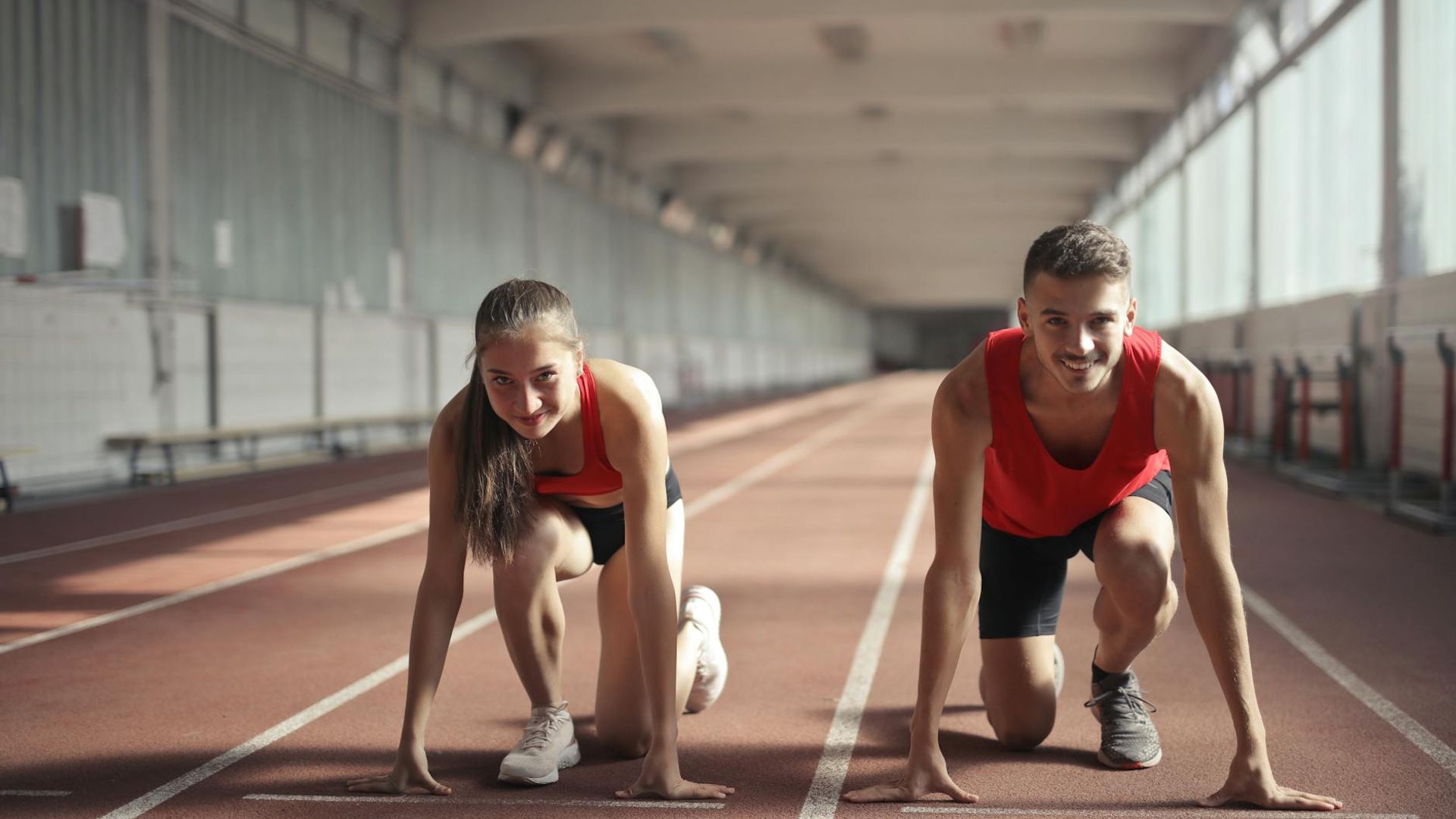 Man in a focused starting position for a strength exercise.