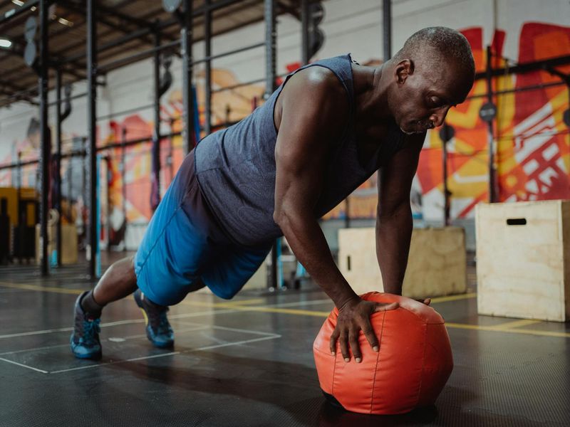 Man performing a controlled push-up with perfect form.
